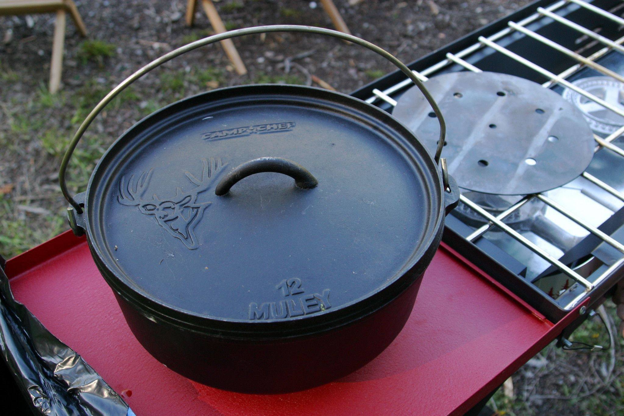 https://trailkitchens.com/cdn/shop/products/camp-chef-12-classic-dutch-oven-cooking-equipment-trail-kitchens.jpg?v=1554230823